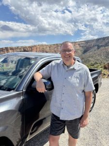 Paul Aspelin your Grand Junction Relocation Guide. Standing in front of his Toyota Tacoma in the Colorado National Monument