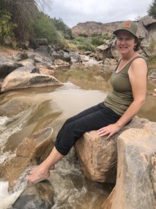 Dominguez Canyon hike Michelle Aspelin dipping toes in Gunnison River