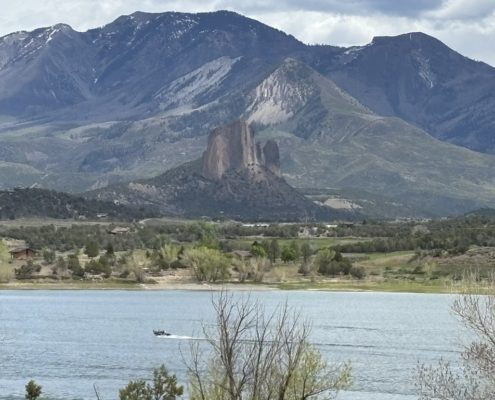 Crawford Reservoir showing boat and mountains in Crawford State Park