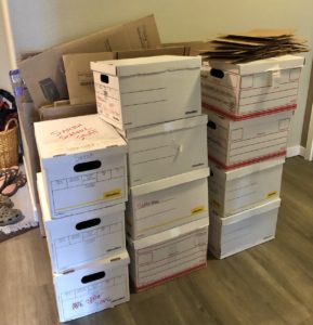 moving preparation boxes piled in the hallway