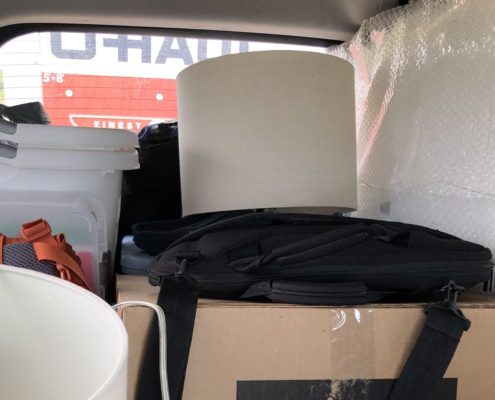 Moving Preparation tips, boxes in vehicle pulling U-Haul