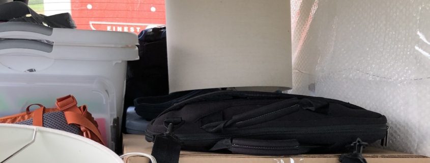 Moving Preparation tips, boxes in vehicle pulling U-Haul