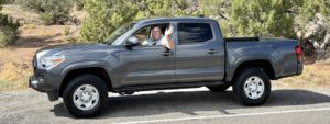 Paul Aspelin waving from his Toyota Tacoma