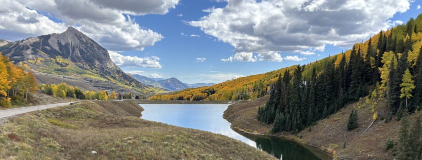 Fall Leaves in Crested Butte with mountain in the back and small lake in the foreground