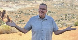 Paul Aspelin standing at the top of Serpents Trail overlooking Grand Junction