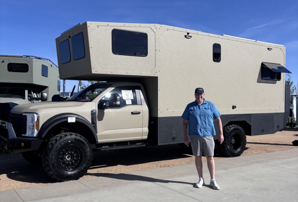 expedition rig at Overland Expo Mtn West with Paul Aspelin standing in front