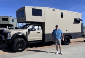 expedition rig at Overland Expo Mtn West with Paul standing in front