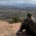 10-Day Grand Junction Challenge Megan Jirele Writer sitting on slickrock looking out over the valley towards Grand Junction