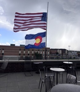 View from on top of a CMU campus building with the American Flag and Colorado Flag flying