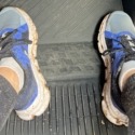 Megan's muddy shoes while she's sitting in the truck