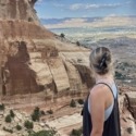Megan Jirele overlooking Grand Junction from the top of Serpents Trail in the Colorado National Monument