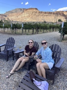 Michelle and Megan sitting in chairs at the Colterris Winery in Palisade